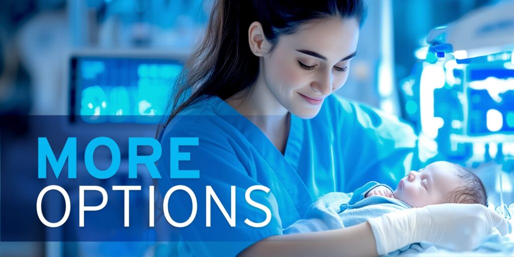 Smiling medical worker in blue scrubs and white gloves holding a sleeping child, with medical equipment in the background.